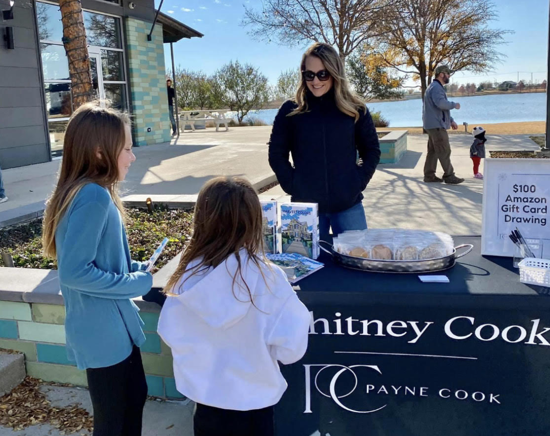   Here's Whitney Cook handing out her coloring books to local residents !  